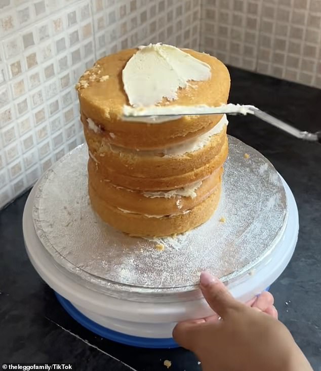 She sliced the curved top off each of the cakes so they could neatly be stacked on top of eachother