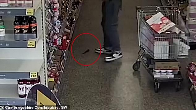 Deasley was loading his bag with goods from the convenience store when a knife fell out of his trousers