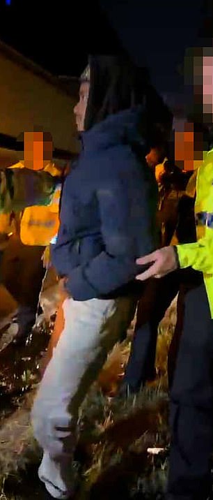 The two young men were arrested on the side of the M11 after a teacher called the police after banging and cheering was heard below the coach