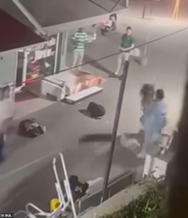 The two confronted each other with bags strewn across the pavement