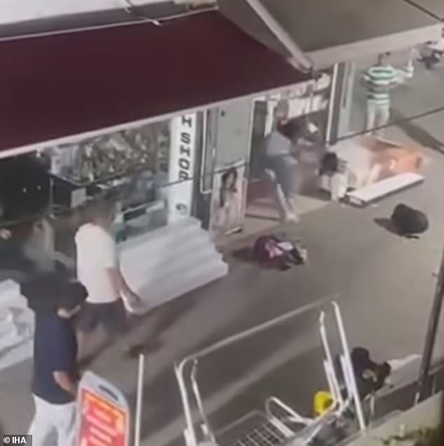 The two went in a shop only re-emerge seconds later and continue their brawl