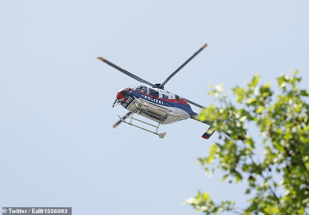 One clip shows a helicopter flying over the area