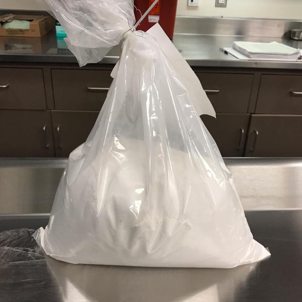 Bag of white cremated remains.