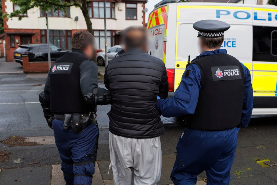 Police officers escorting a suspect.