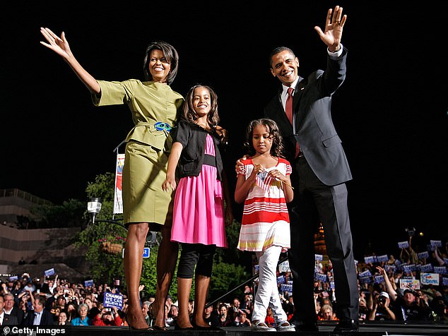 Michelle, Malia, Sasha and Barack Obama are pictured during a rally in May 2008
