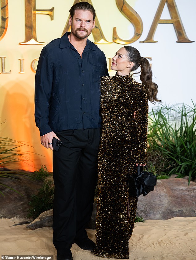 It comes after Ryan admitted he struggles with being a 'modern-age dad' who earns less than his fiancee, Louise (pictured together in December)