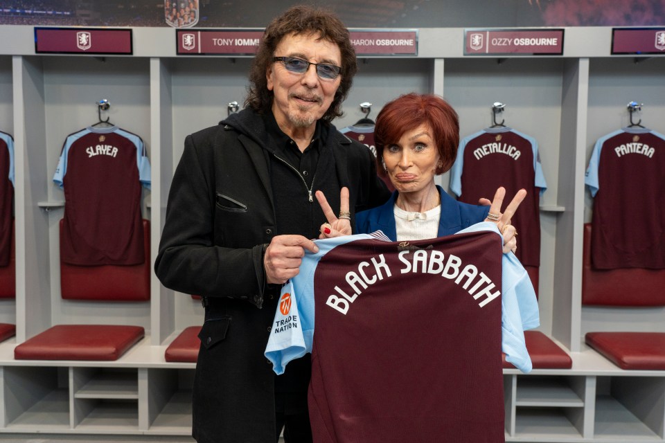 Tony Iommi and Sharon Osbourne holding a Black Sabbath jersey.