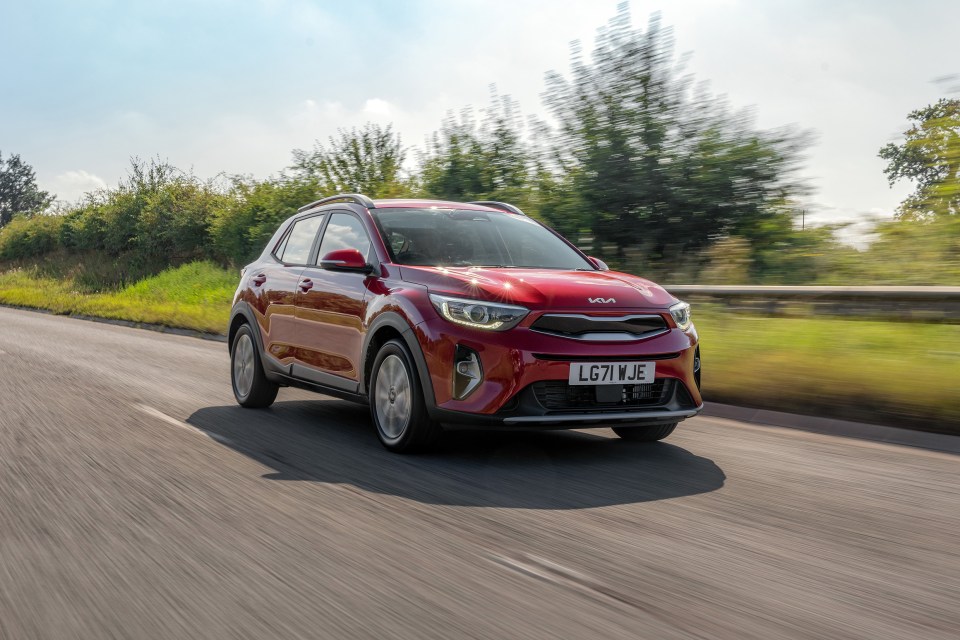 Kia Stonic driving on a road.