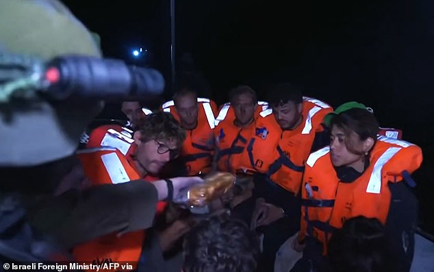 An image shared by the Israeli Foreign Ministry of what the ministry said were passengers on the Madleen Gaza-bound aid boat being given sandwiches