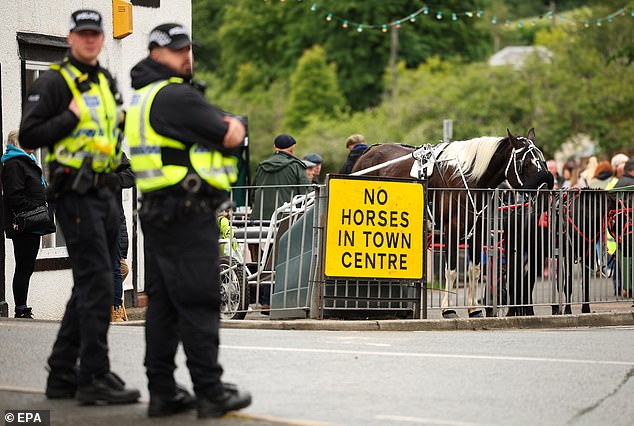 Police officers look on during the Appleby Horse Fair in Appleby-in-Westmorland last Thursday