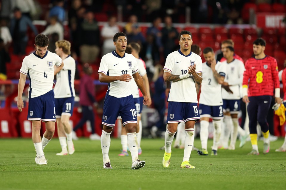 Declan Rice and Jude Bellingham of the England national football team looking dejected after a match.
