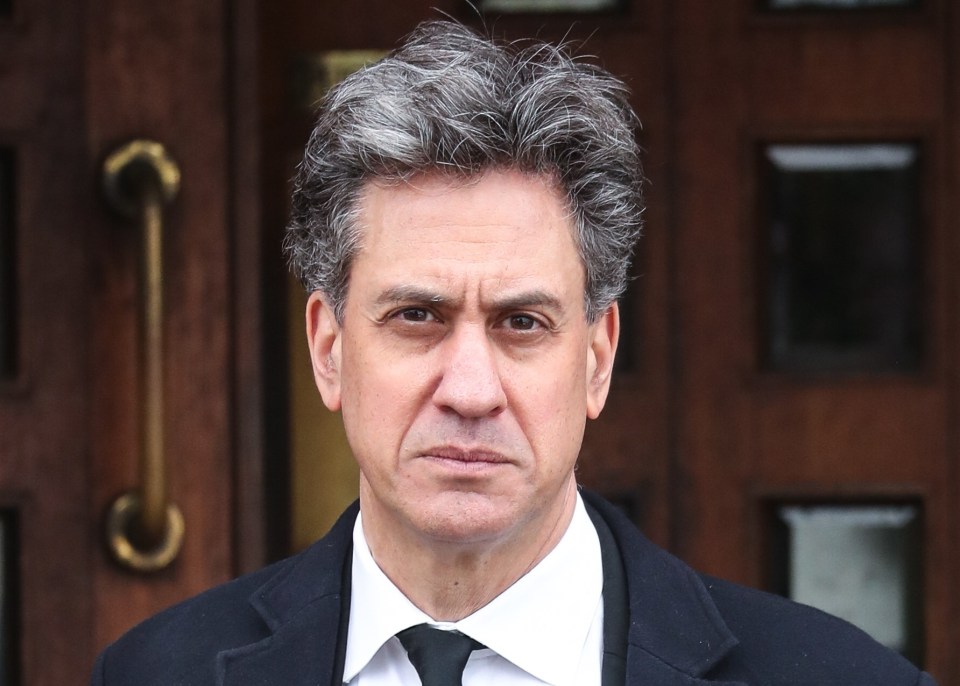 Ed Miliband departing a church after a funeral.