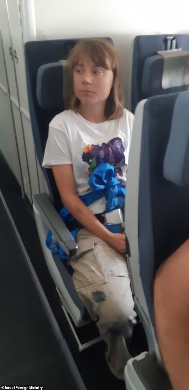 The activist looked glum as she was flown back to Sweden from Israel after being intercepted on her way to Gaza