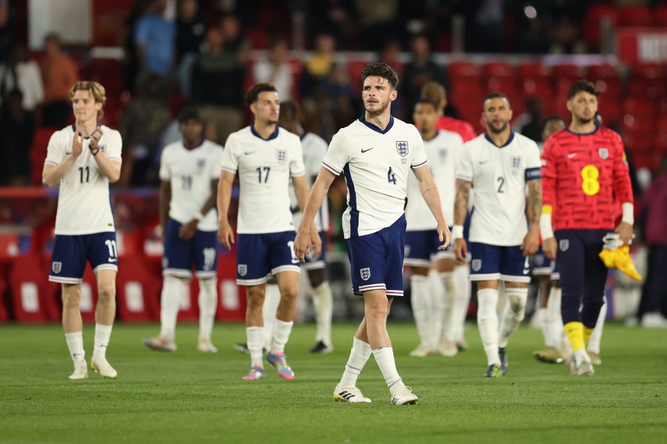 Declan Rice and the England football team looking dejected after a match.