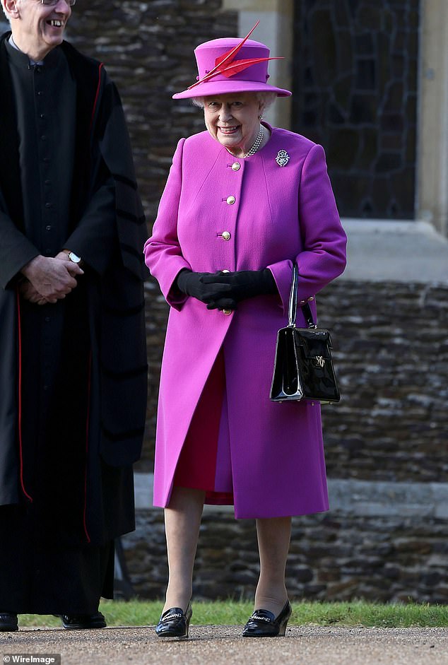 Queen Elizabeth showcases a feathered hat by Rachel Trevor-Morgan on Christmas Day at Sandringham in 2014