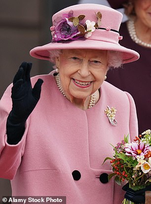Queen Elizabeth corresponds her hat to her pale pink cat at the opening ceremony of the sixth session of the Senedd in Cardiff in 2021.