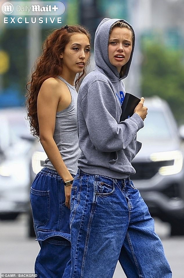 Shiloh, Pitt and Jolie's 19-year-old Namibia-born daughter, legally changed her last name last year on the day she turned 18, dropping Pitt and officially opting to be known as Shiloh Nouvel Jolie. (Pictured: Shiloh with a friend in May).