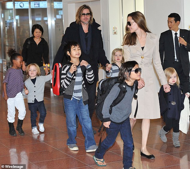 Nine years on from Angelina and Brad's split, Pitt now appears ready to cut ties with at least two of his children while desperately holding out hope for reconcile with the other four. (Pictured: Brad and Angelina with Maddox, Pax, Zahara, Shiloh, Knox and Vivienne in 2011).