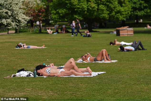 Last month was the second-hottest May on record, experts reveal. Pictured, sunbathers in St James's Park, London, May 1, 2025
