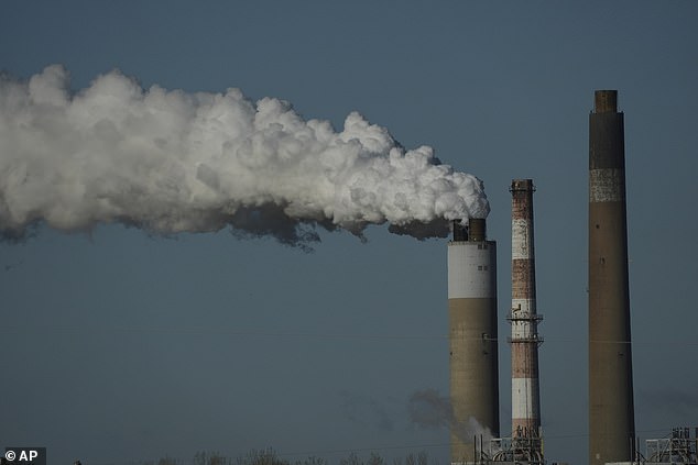 Experts point to human-cased greenhouse gas emissions as the cause for this latest temperature 'anomaly'. Most emissions come from burning fossil fuels such as coal for power. Pictured, a coal-fired power station in Newburgh, Indiana