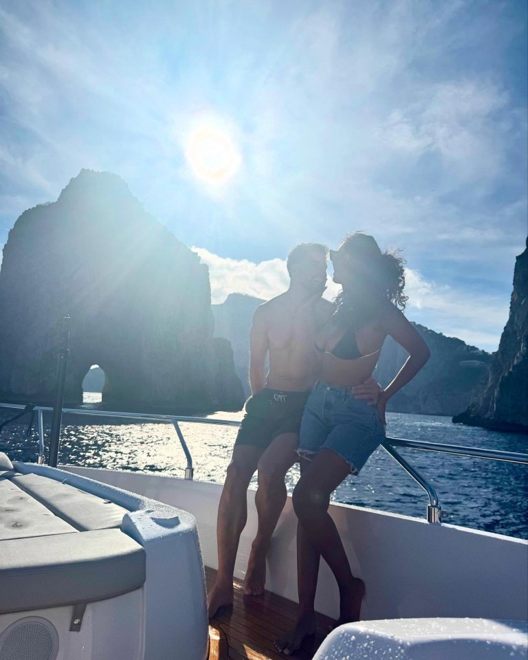 Couple on a boat in Amalfi Coast.