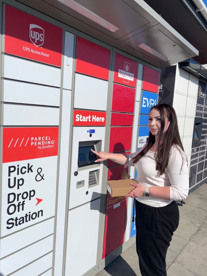 Woman using a parcel pick-up and drop-off station.