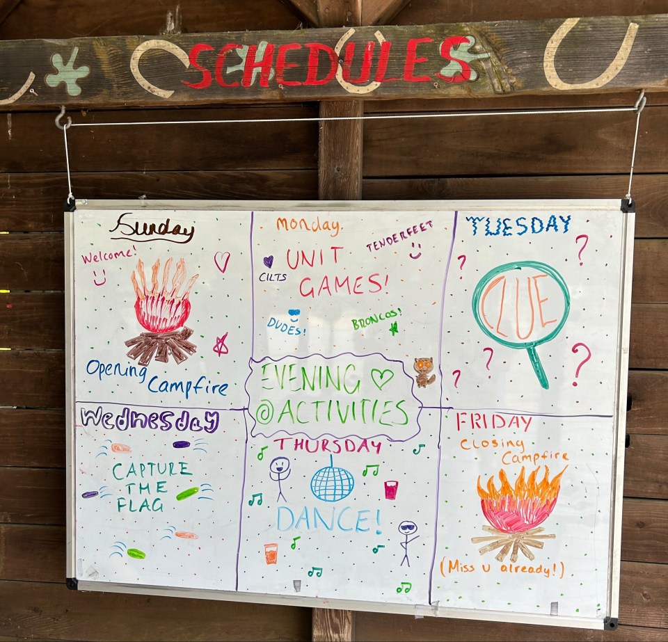 Weekly summer camp schedule on a whiteboard.