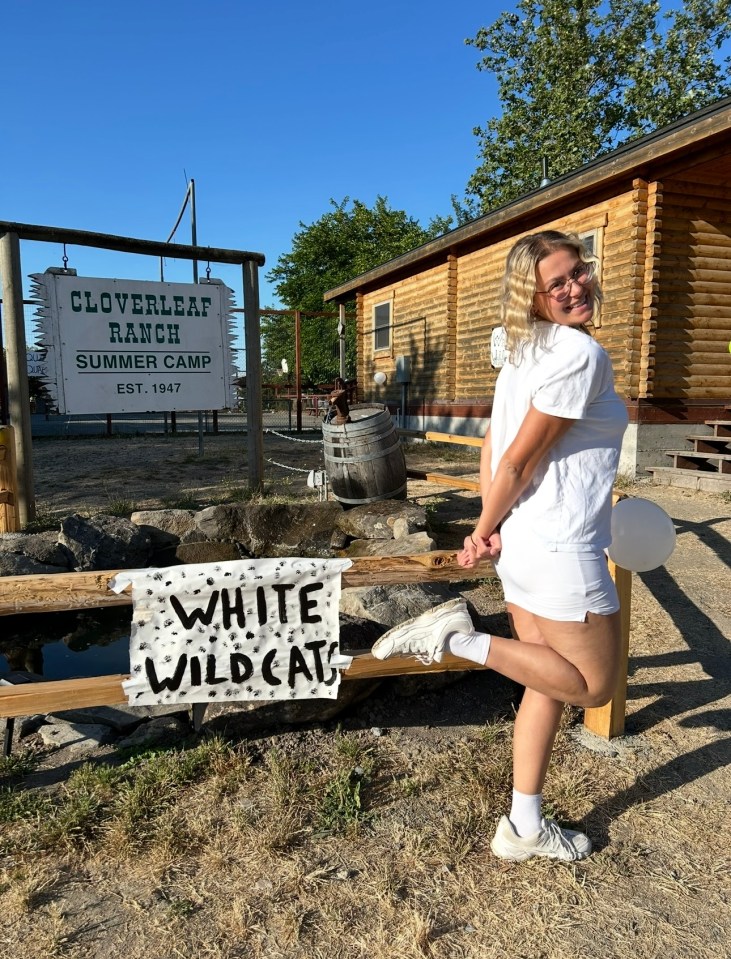 Woman in white shorts and t-shirt at Cloverleaf Ranch Summer Camp.