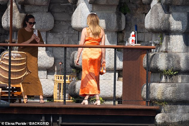 At one point during the afternoon, Stacey slipped on an orange satin dress and shot some content with the help of a colleague