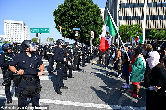 LOS ANGELES, CALIFORNIA - JUNE 9: Police and national guards take measures as thousands of anti-ICE protesters are gathered outside of the Federal Building in Los Angeles, California on June 9, 2025 amid protests over immigration raids. (Photo by Tayfun Coskun/Anadolu via Getty Images)