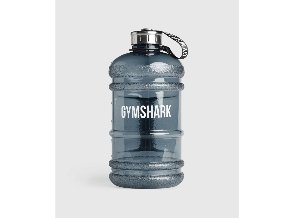 a gymshark water bottle against a green background