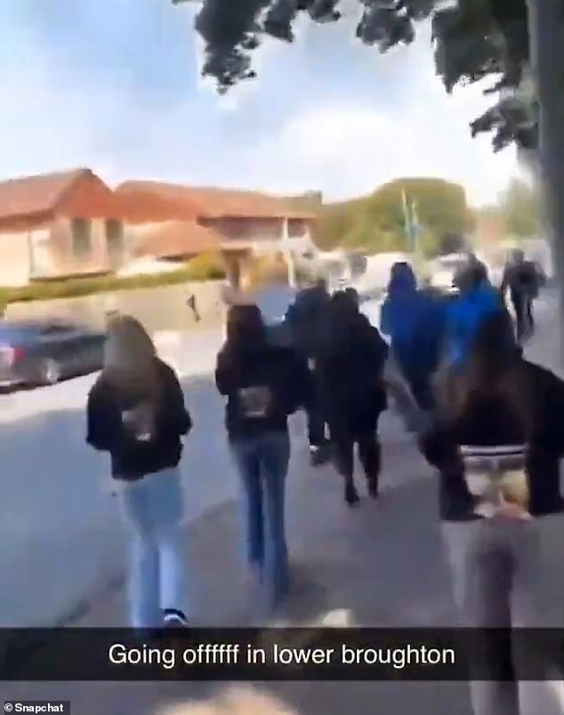 Riots have erupted on the streets of Salford after '60 masked youths' set fire to a car