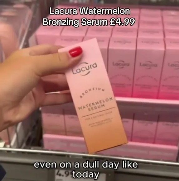 Hand holding Lacura Watermelon Bronzing Serum (£4.99).