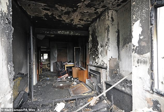 A burnt-out house on Queen Street today after a second night of violence in Ballymena