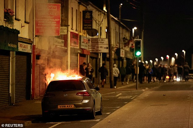 People's cars were set on fire throughout the town and their windows smashed in