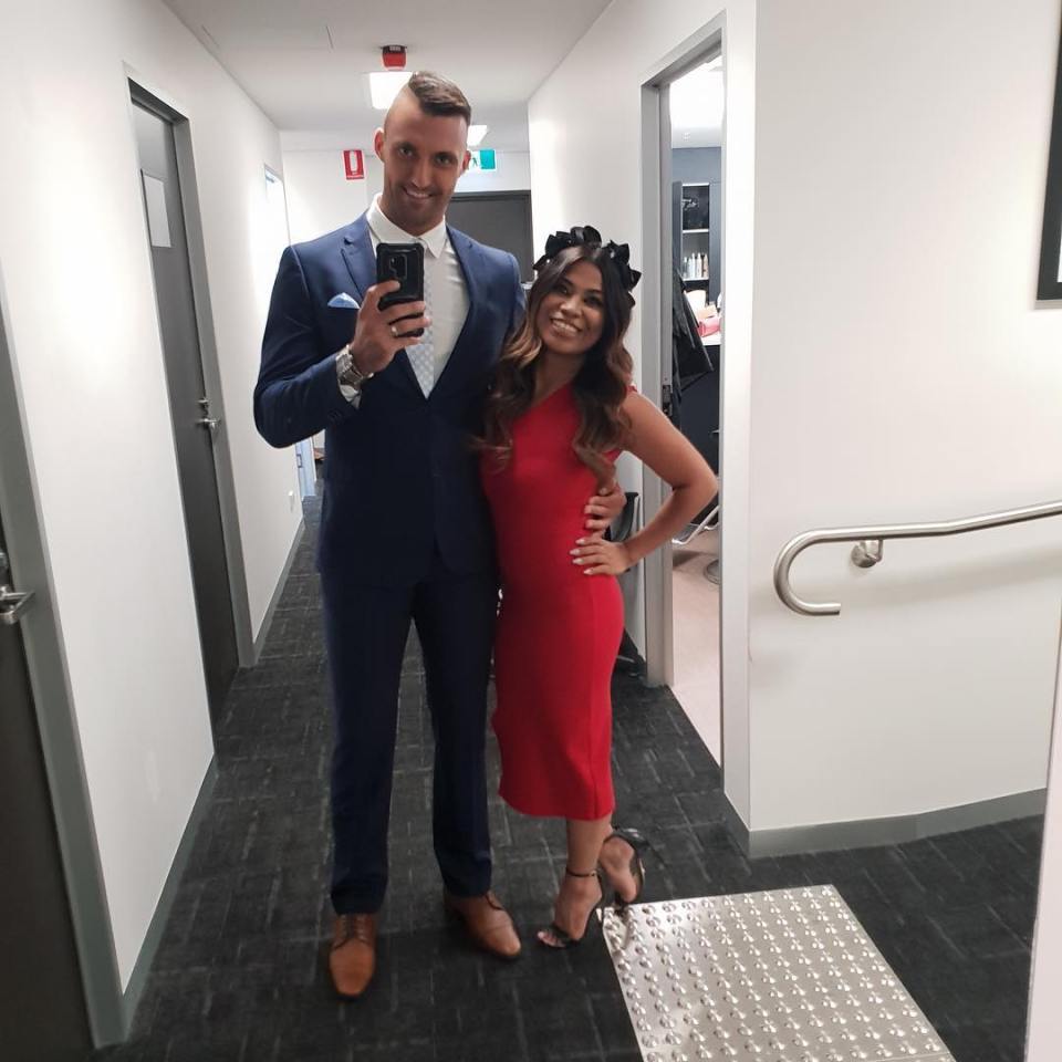 Nicolas Jovanovic and Cyrell Paule in formal wear taking a selfie.