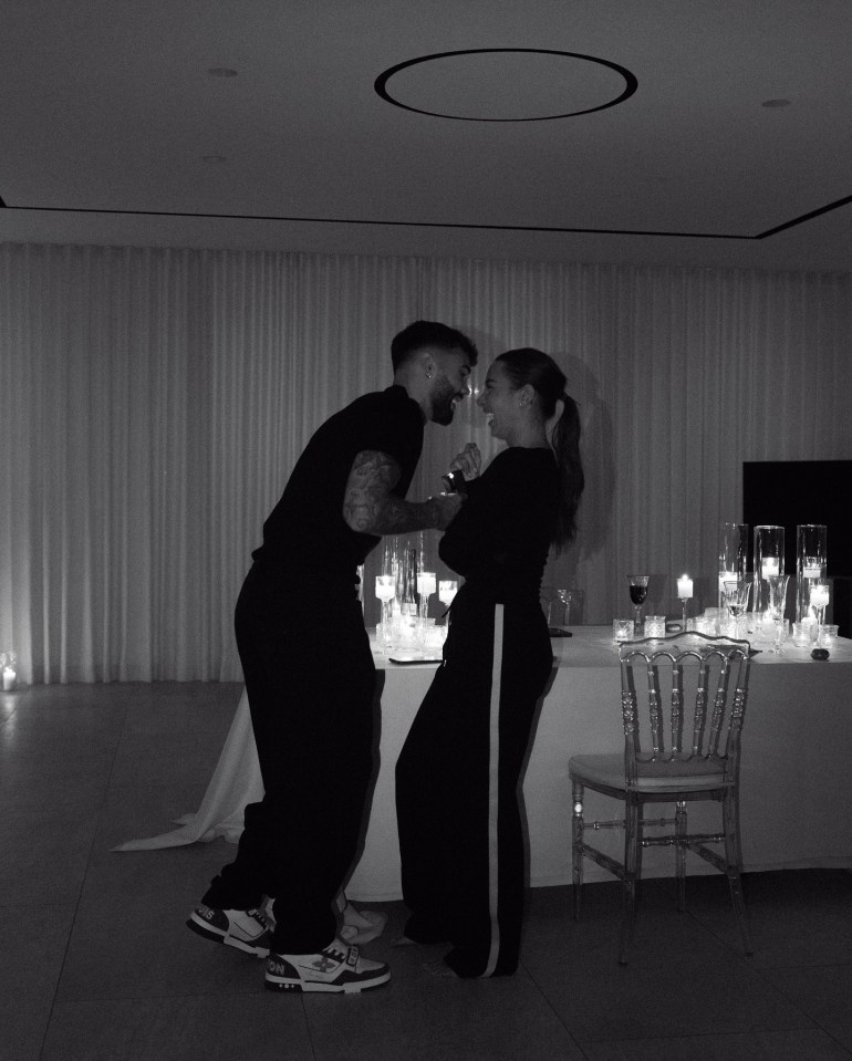 Black and white photo of a couple embracing.
