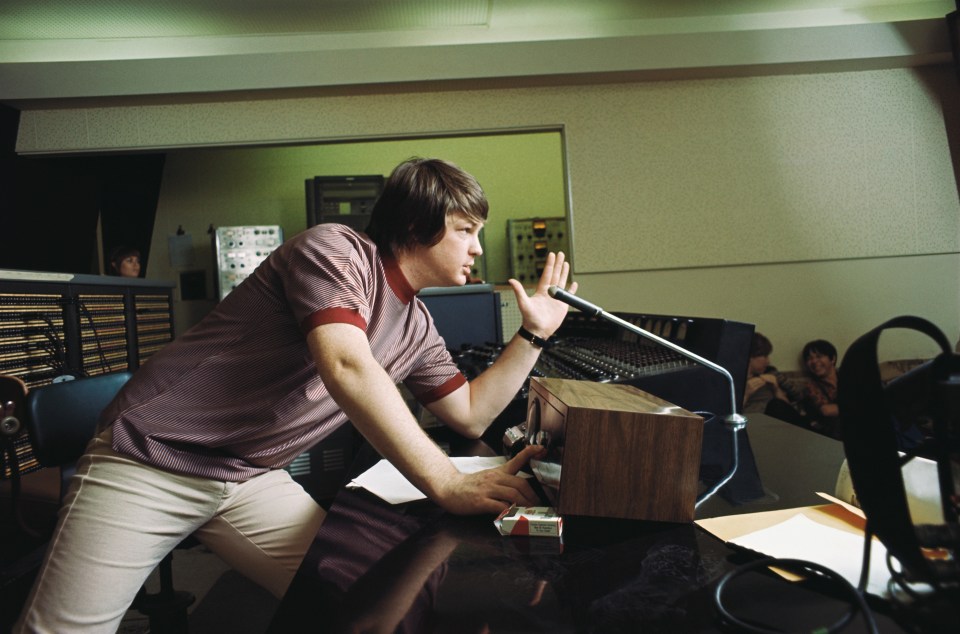 Brian Wilson of the Beach Boys directing a recording session for the album *Pet Sounds*.