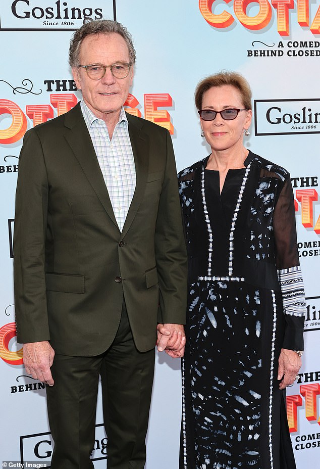 The Breaking Bad star said he has to 'find ways' to deal with fame impacting his marriage (pictured with wife Robin Dearden in July 2023)