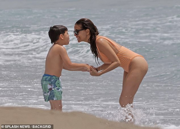 She bent down to gaze at her son