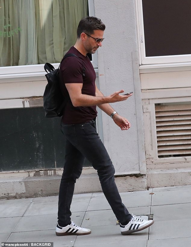 Meanwhile Gethin cut a cool figure in a burgundy fitted T-shirt which he teamed with jeans and a pair of trainers