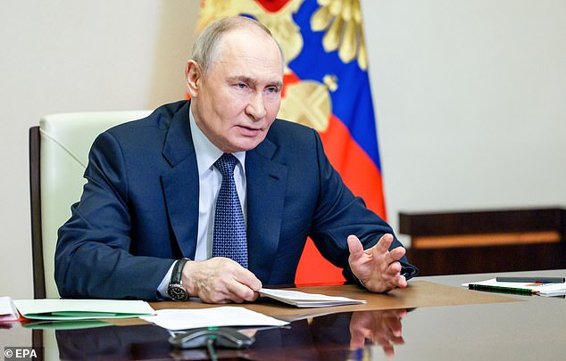 Russian President Vladimir Putin chairs a meeting with members of the security council