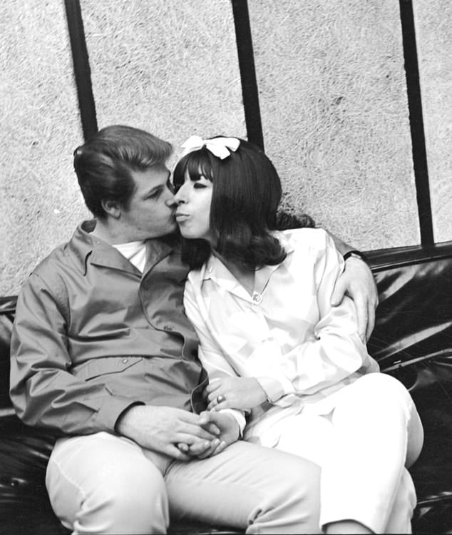 Singer Brian Wilson of the rock and roll band "The Beach Boys" poses for a portrait with his wife Marilyn Wilson aka Marilyn Rovell singer in "The Honeys" in circa 1965 in Los Angeles, California