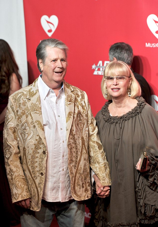Musician Brian Wilson (L) and Melinda Wilson arrive at the 2012 MusiCares Person of the Year Tribute to Paul McCartney held at the Los Angeles Convention Center on February 10, 2012 in Los Angeles, California