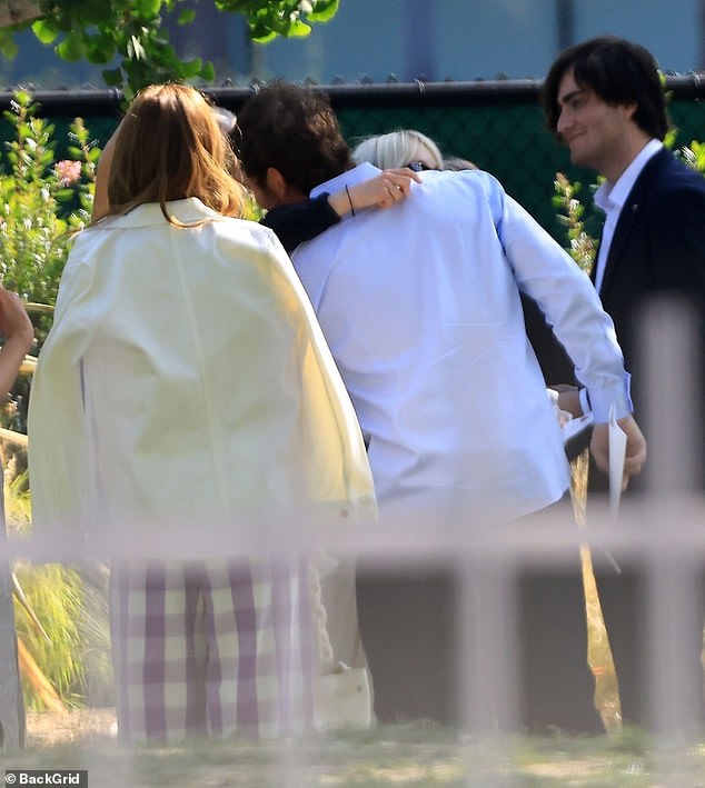 The former married couple proved that all is fine between the both of them as they shared a hug at the celebration