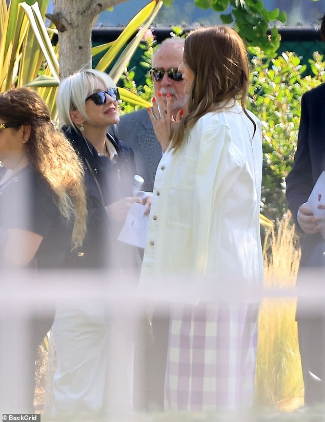 All was good between the action man's ex wife and current wife as they also shared an embrace