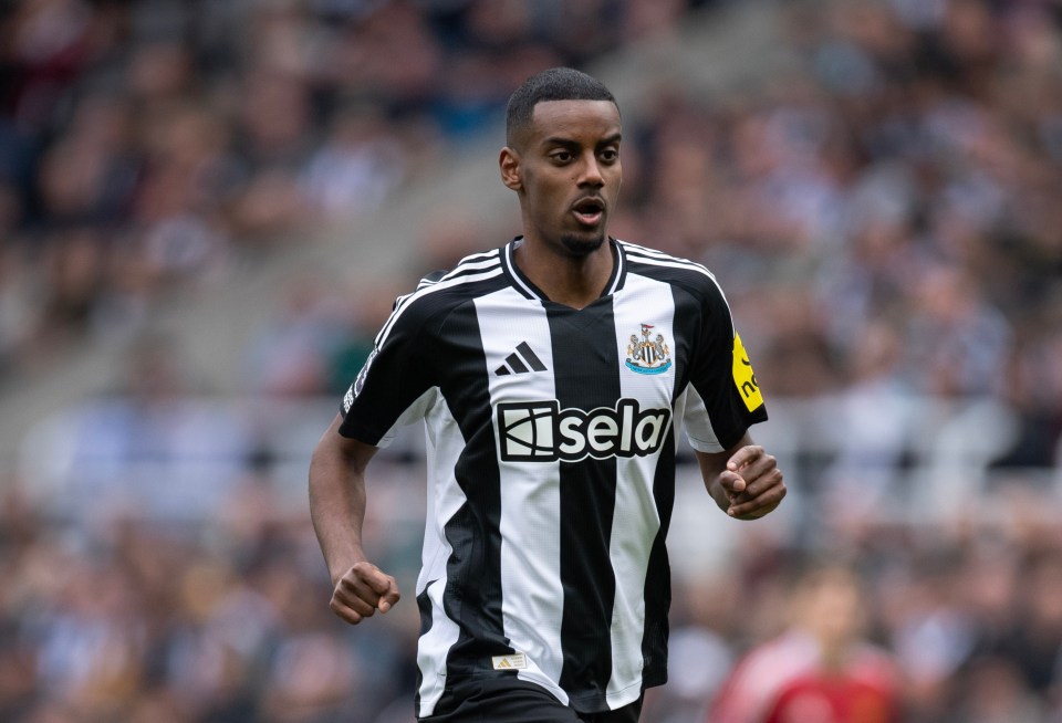 Alexander Isak of Newcastle United running on a soccer field.