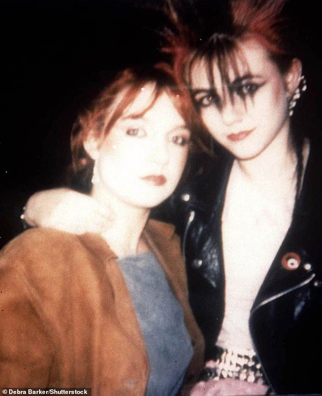 Liz Hurley, who would have been around 18 years old in this picture, also donned brown spiky tresses during her punk phase (pictured in 1983)