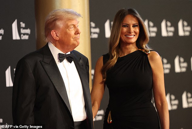 President Donald Trump (left) walking the red carpet with first lady Melania Trump (right) at the Kennedy Center Wednesday night for the opening night performance of Les Miserables