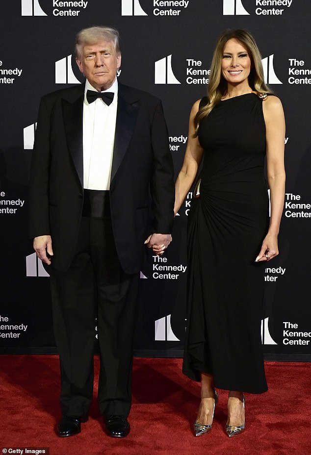 Melania Trump (right) poses alongside her husband President Donald Trump (left) on the red carpet. The president said the first theater production he want to see was 'Cats' while the first lady said hers was 'Phantom of the Opera'